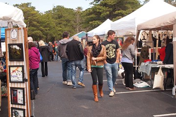 Crowds walk among the 100 + crafters and vendors at Oktoberfest at Historic Smithville.