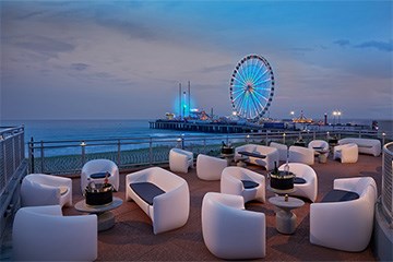 The Terrace at Hard Rock Hotel & Casino Atlantic City, N overlooking the Steel Pier and Atlantic Ocean.