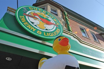 Ducktown Tavern with rubber ducky and exterior sign.