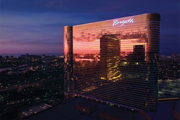 Borgata Hotel Casino & Spa at dusk with reflections of MGM Tower.