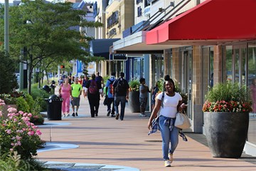 Fall shoppers walking near stores at Tanger Outlets Atlantic City.