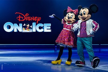 Disney On Ice - Mickey and Minnie pose on ice skates.