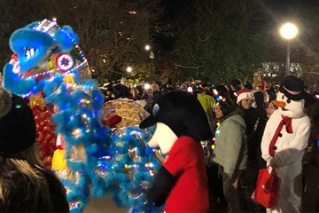 Chelsea Neighborhood Holiday Tree Lighting characters in elaborate holiday costumes.